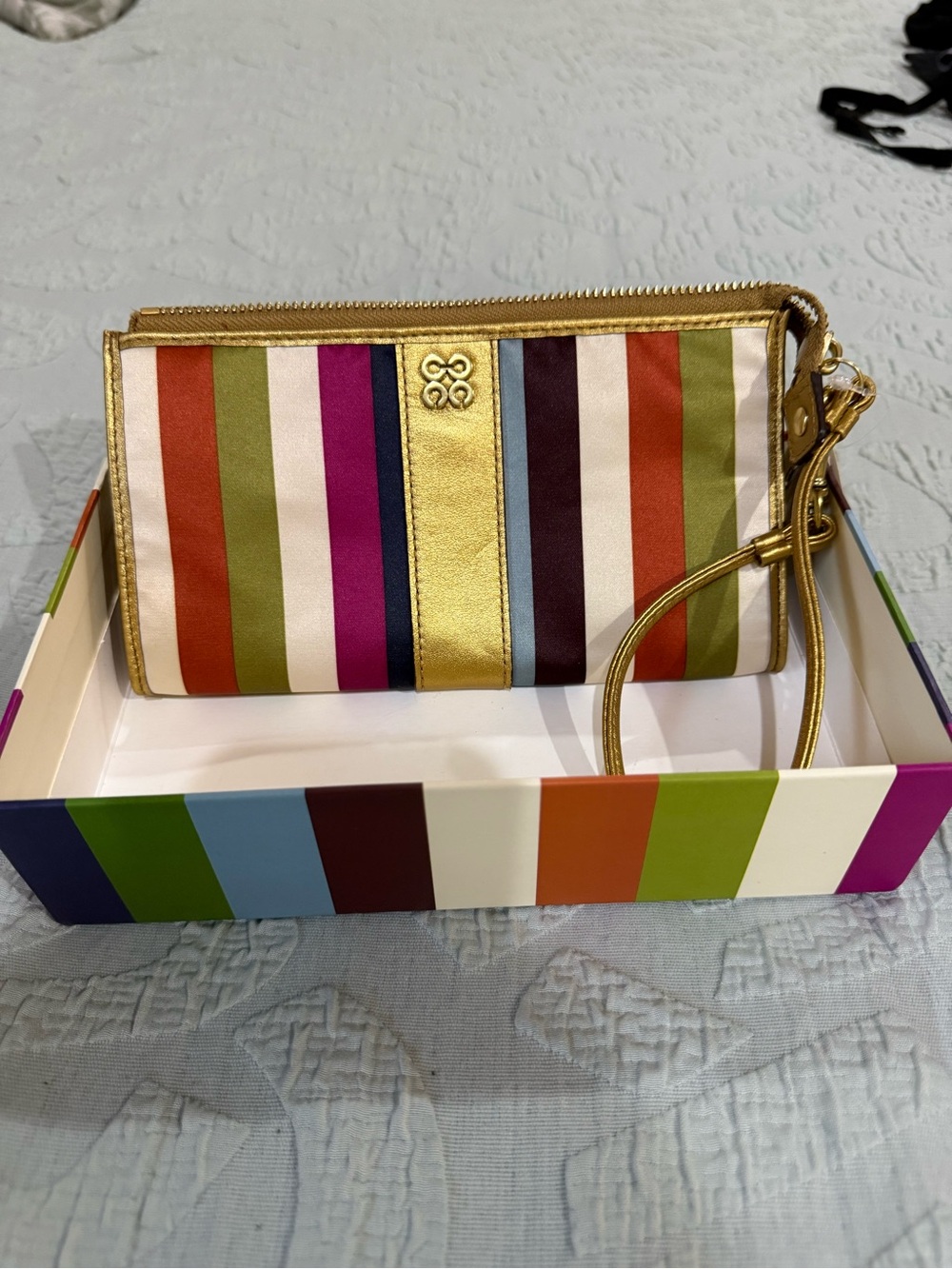 New Coach Striped Multicolor Wristlet with Gold Trim. Comes with tags and box.